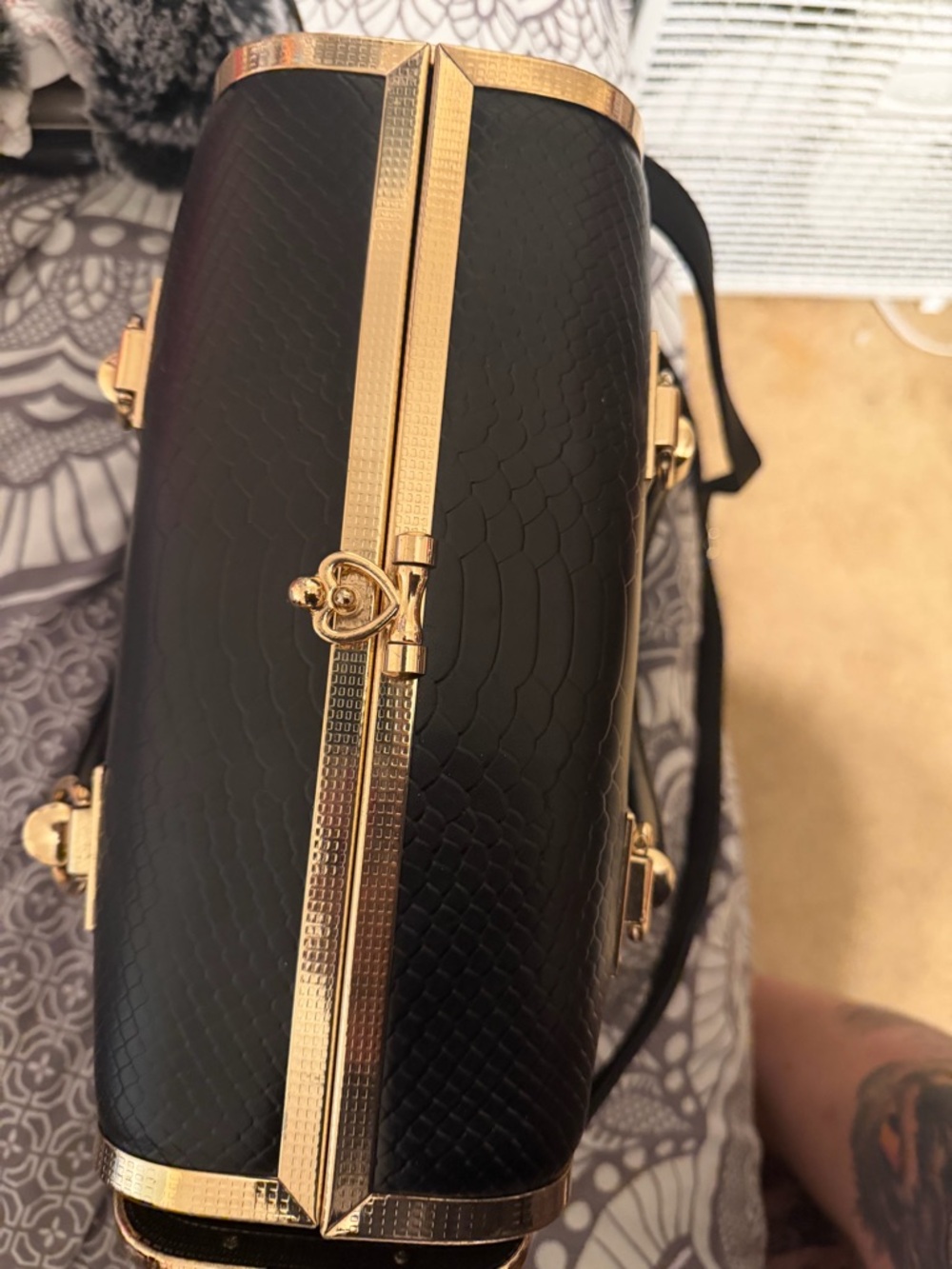 Black Textured Clutch with Gold Trim and Heart Lock